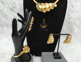 Elegant Dubai Gold-Plated Statement Necklace Set with Sculptural Coil Design – Matching Bracelet, Ring & Earrings