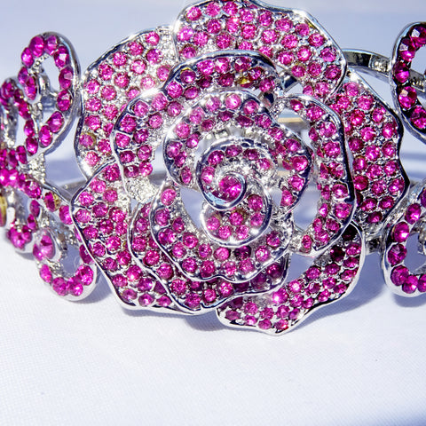 Pink Vintage style Glitzy Glam rose shaped crystal bracelet in a cuff style gleaming with clear crystals on a rhodium plated high quality finish – True celebrity style Glamour!